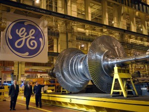 President Barack Obama looks at a turbine during a tour in 2011 of the General Electric plant in Schenectady, N.Y., with then GE Chairman and CEO Jeffrey Immelt (left) and plant manager Kevin Sharkey.